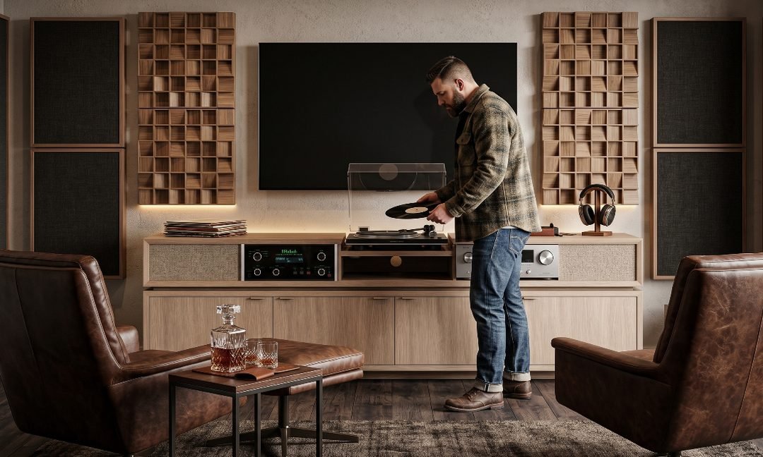 Listening wall with a turntable, audio cabinets and a television between acoustic panels